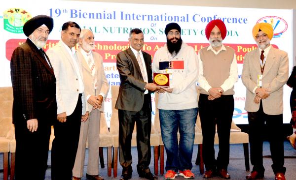 Dr. Inderjeet Singh, VC GADVASU, Dr. Parkash Singh Brar and other dignitaries  honoring awardee